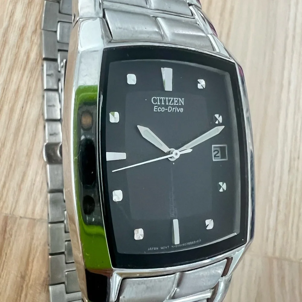 Citizen eco-drive rectangular black dial silver tone solar dress watch